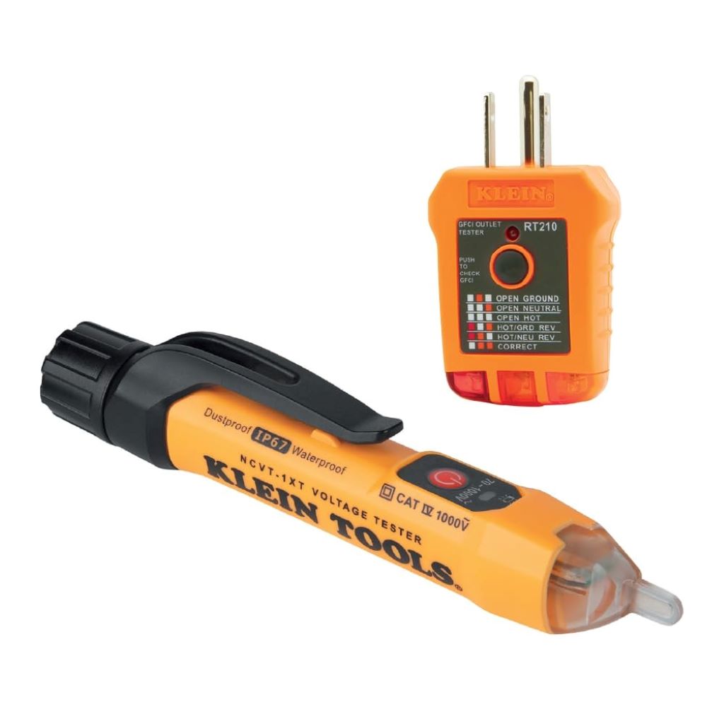 Klein Tools NCVT1XTKIT voltage tester and GFCI outlet kit on a workbench for electrical safety.