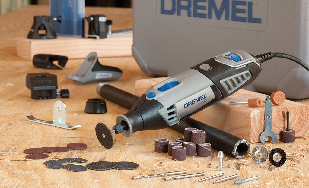 Close-up of hands tightening hardware with a screwdriver, depicting professional tips for securing fixtures at home.