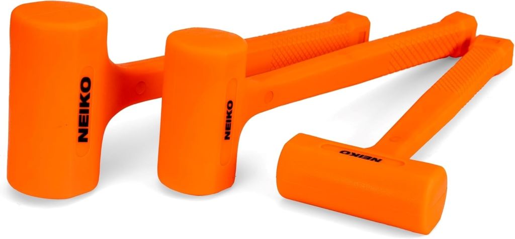 Professional mechanic using NEIKO 02888A dead blow hammer set with checkered grips.