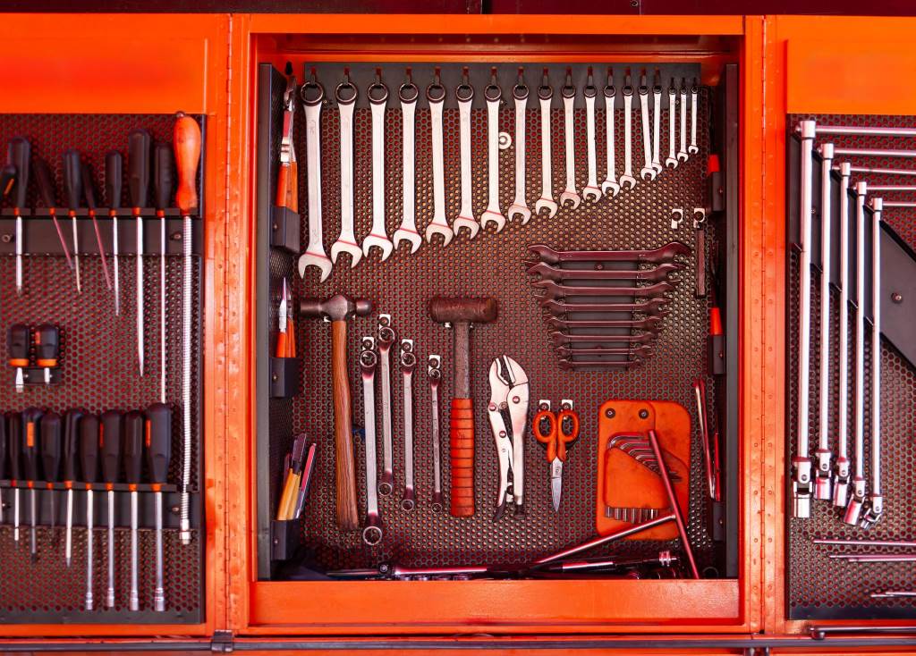 Professional mechanic tool kit organized in garage workspace