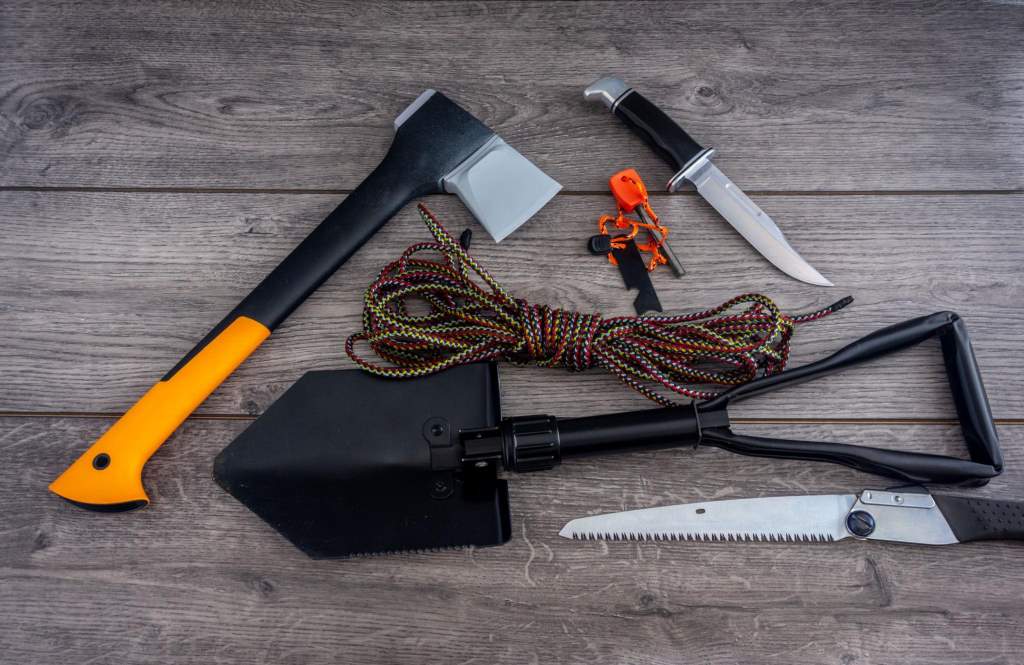 Survival axe chopping wood in forest emergency scenario