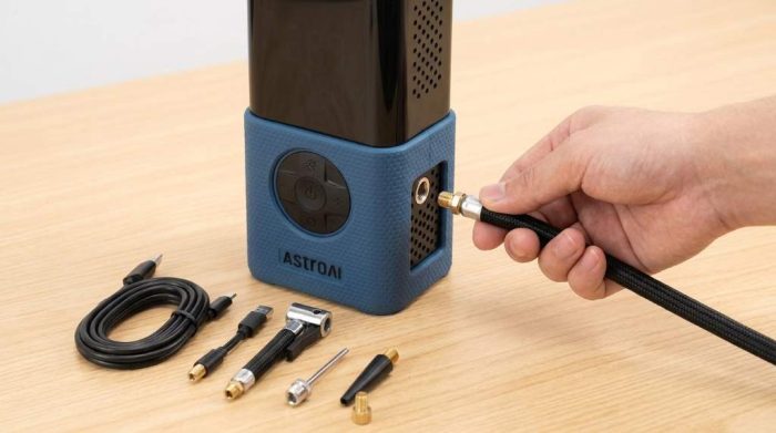 Inflating a car tire with AstroAI portable air compressor